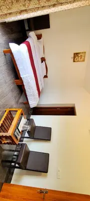 two bunk beds in a room with white walls at AJ Groups B&B Residency in Ooty