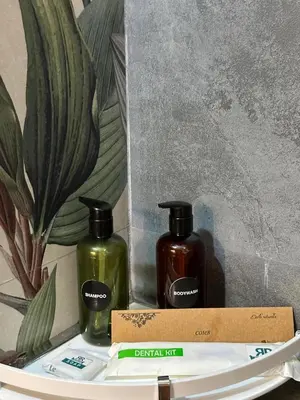 two bottles of soap sitting on top of a box at RR Forest View in Ooty