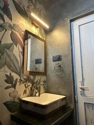 a bathroom with a sink and a mirror at RR Forest View in Ooty