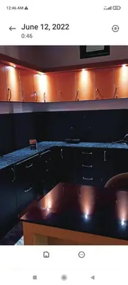 a view of a room with a desk and cabinets at Blue mount stay in Gūdalūr