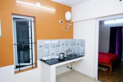 a kitchen with a sink in a room at Ooty Horizon Heights in Ooty