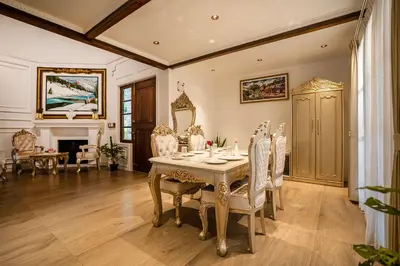 a dining room with a table and chairs at Regenta Resort Mysore Tropical Village in Chāmundi