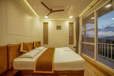 a bedroom with a bed and a large window at The Haven by Xplore Indo in Ooty