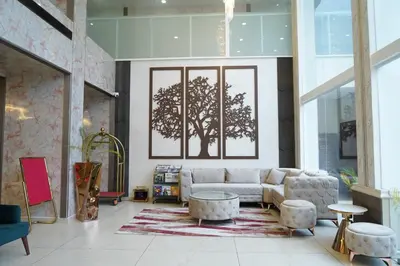 a living room with a couch and a table at BINI Heritage in Trichūr
