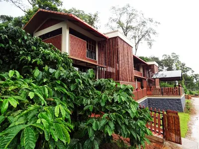 a house with a fence in front of it at Villa Katipadu Coorg in Srimangala