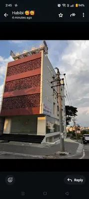 a building on the side of a street at SAHAR HOMEstay 02 in Mysore