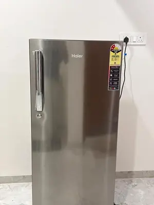a stainless steel refrigerator with a hello sign on it at SAHARHOMEstay O3 in Mysore