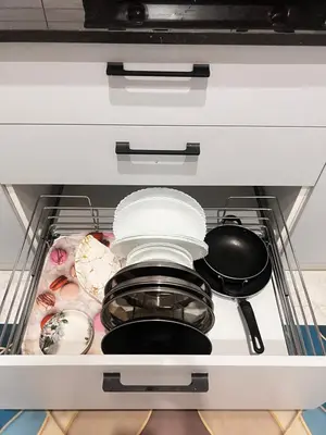 a drawer filled with food and utensils at SAHARHOMEstay O3 in Mysore