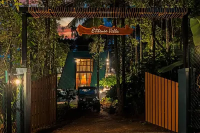 a house with a sign that reads chinese music at Ethnic Villa Wayanad in Kenichira