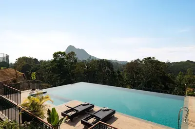 a swimming pool with a view of a mountain at Morickap Lord's 83, Trademark Collection by Wyndham in Meenangadi