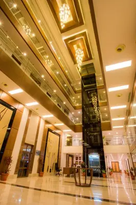 a lobby of a building with a clock tower at The Atrium Boutique Hotel in Mysore