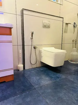a bathroom with a toilet and a shower at Golden Hills cottage munnar Mankulam Munnar in Viripara