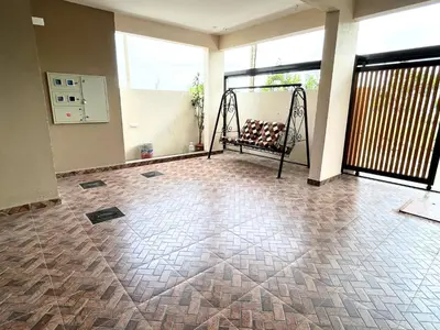 a empty room with a bench on a balcony at Mannat Inn Classic Premium - 3BHK in Mysore