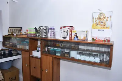 a wooden shelf with many items on it at Beyond Ghatts Homestay in Dhali