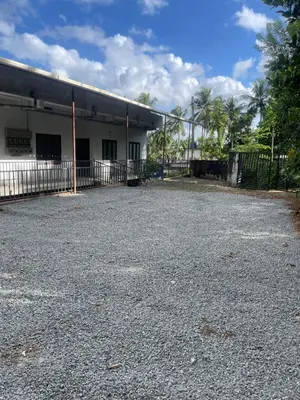 an empty parking lot in front of a building at Scott legacy apartment in Kulattūr