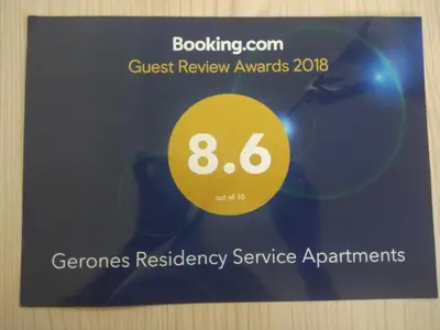 a sign for the guest review awards at a technology service appointment at Gerones Residency Serviced Apartments & Home Stays in Coimbatore