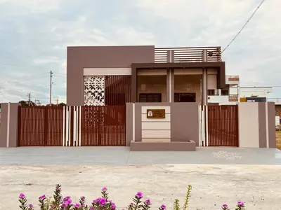 a house with a gate and a fence at A B House in Kollegālam