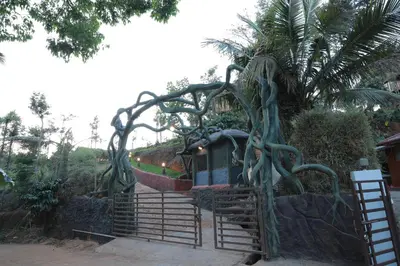 a playground with a train in a park at Blue Bell Resort in Periya