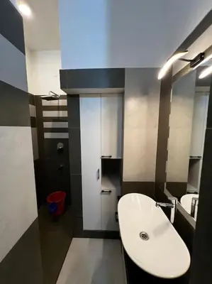 a bathroom with a white sink and a toilet at Dutch Heaven - Luxury Rental Villa Near Cochin Airport in Nedumbassery