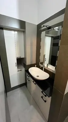 a bathroom with a white sink and a mirror at Dutch Heaven - Luxury Rental Villa Near Cochin Airport in Nedumbassery