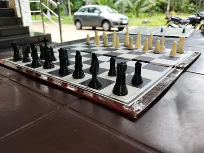 a chess board on top of a table at Limra Farm House in Pollāchi
