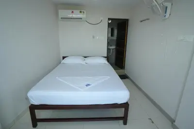 a hospital room with a bed in the corner at Port View Residency PVR in Nedumbassery