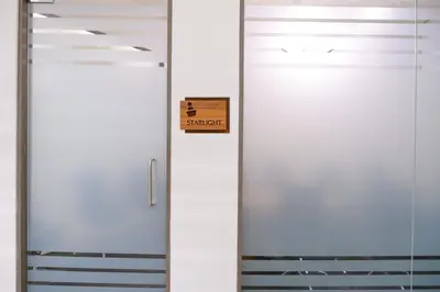a door with a sign that readsstudent at 0484 Aero Lounge-Terminal 2 Cochin Airport Hotel in Nedumbassery
