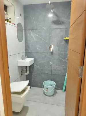 a bathroom with a toilet and a sink at Krishnarpanam 2BHK villa in Guruvayoor- only for families in Guruvāyūr