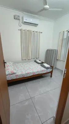 a room with a bench in the corner of a room at Krishnarpanam 2BHK villa in Guruvayoor- only for families in Guruvāyūr
