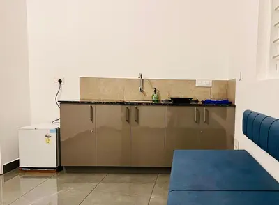 a kitchen with a sink and a counter at Hill View Heights Wayanad in Meppādi
