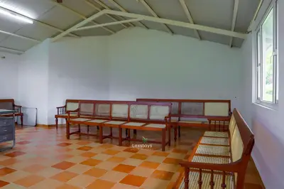 a room with wooden benches and a checkered floor at 42 Green Pastures By Lexstays -Tea Estate Experience in Coonoor