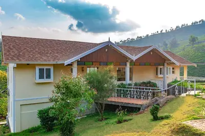 a house on a hill with at 42 Green Pastures By Lexstays -Tea Estate Experience in Coonoor