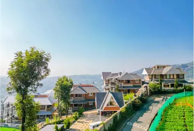 an aerial view of houses in a suburb at Kanavu Valley View in Ooty