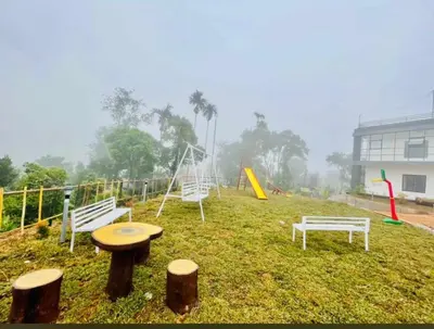 a group of playground equipment in a park at Mountain Wings Resort in Vythiri