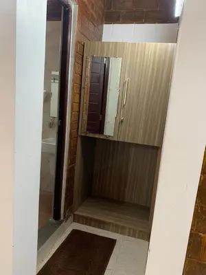 a bathroom with a shower and a mirror at Love Green Resorts in Palladam