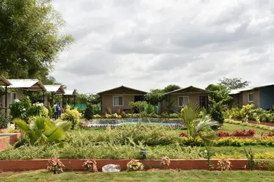 a row of houses in a garden at Valley Vibes in Rāmanagaram
