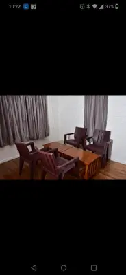 two chairs and a table and two tables and chairs at Attuvam Valley in Kodaikānāl
