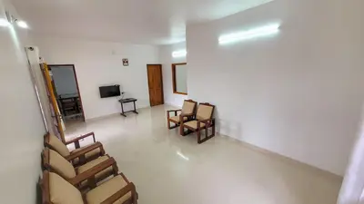 a waiting room with chairs and a television in it at Home stay in Kanthalloor