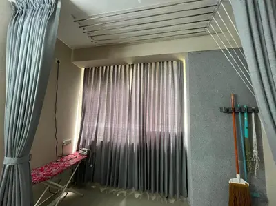 a room with a large window with a curtain at A4, Melam, Hima Havens- 200 m from Guruvayoor Temple in Guruvāyūr