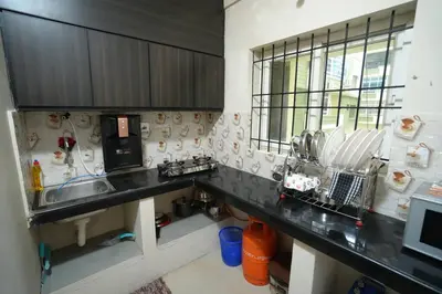 a kitchen with a sink and a counter top at A4, Melam, Hima Havens- 200 m from Guruvayoor Temple in Guruvāyūr