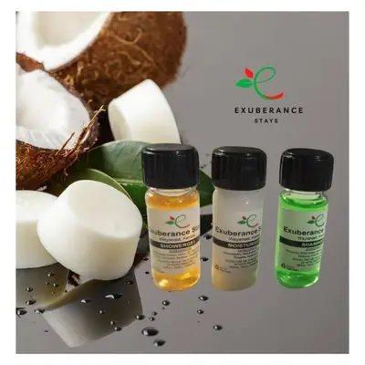 three bottles of essential oils sitting next to some food at Exuberance Villa in Batheri