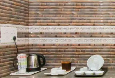 a table with a coffee pot and a plate of food at Exuberance Villa in Batheri