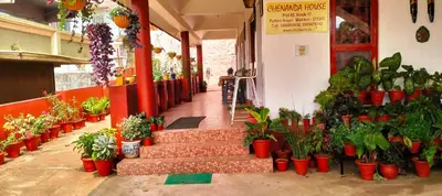 a store with a bunch of potted plants at Holidayincoorg - Brick lane in Madikeri