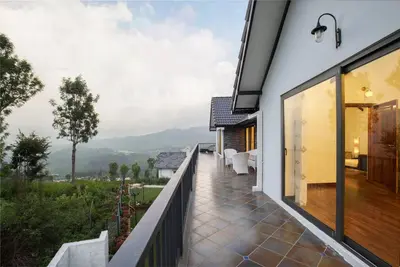 a balcony with a view of a house at Shangrila Casa-Premium Homestay in Wellington Town