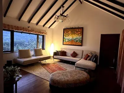 a living room with a couch and a table at Shangrila Casa-Premium Homestay in Wellington Town