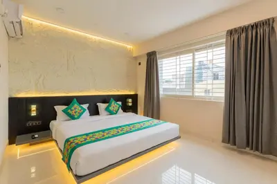 a bedroom with a large bed in a room at Treebo Sanmaya Retreat, 15 Mins From Mysore Palace in Mysore