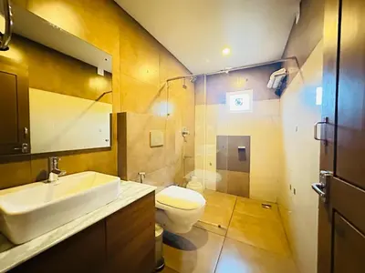 a bathroom with a sink and a toilet at City Palace Residency Nilambur in Wandūr