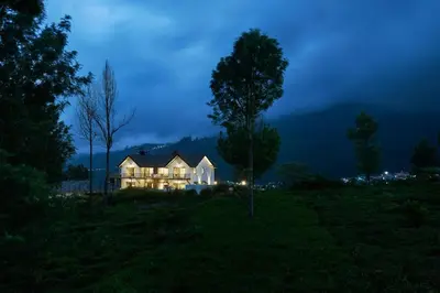 a house in the middle of a field at night at Shangrila Casa-Premium Homestay in Lovedale