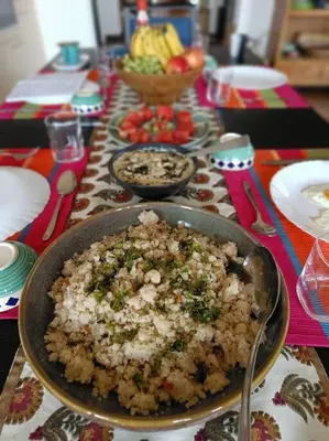 a table with a bowl of food on a table at Shangrila Casa-Premium Homestay in Lovedale