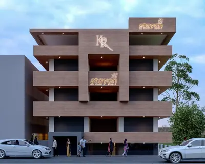 a building with people walking in front of it at Stayon Hotels in Palakkad